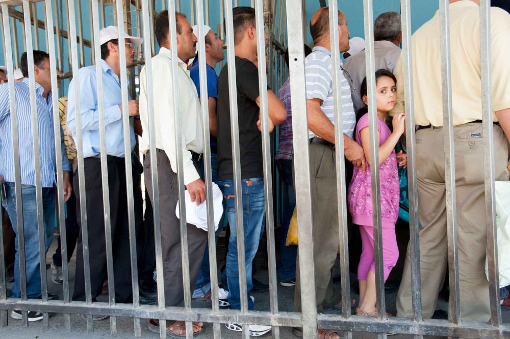 Palestinians seeking to pass through Checkpoint 300 between Bethlehem and Jerusalem, 2012