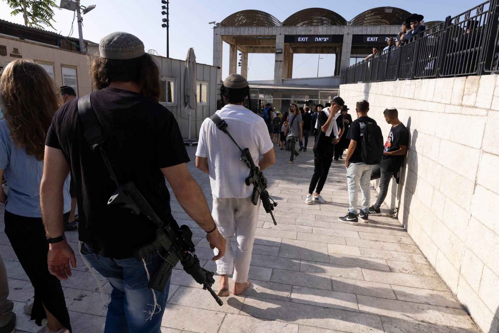 Israeli settlers about to enter the al-Aqsa compound at the entryway used by non-Muslims, during the annual Tisha B’Av holiday, August 7, 2022.