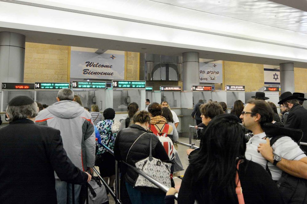 Travelers entering Israel waiting in line at the passport control on arrival to Ben Gurion Airport in Tel Aviv, Israel