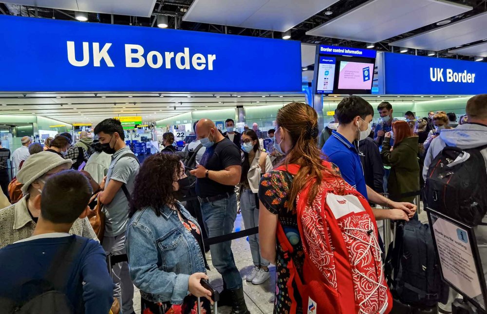 Travelers lined up at the UK Border point, Heathrow Airport, London UK, August 6, 2021