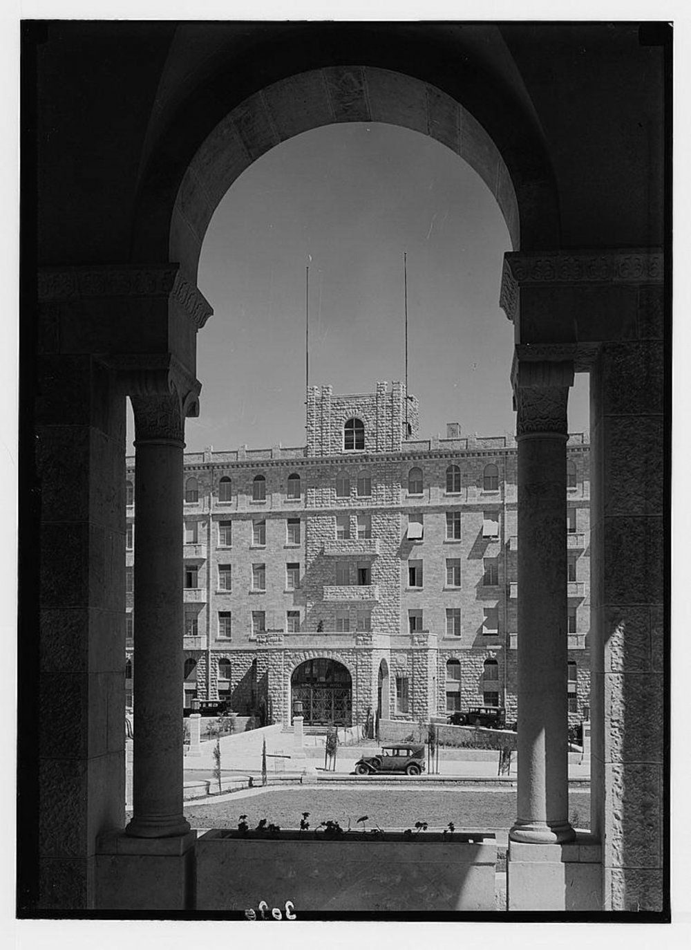 The view of the King David Hotel as seen if one stands in the arches of the YMCA, which is across the street from the hotel, ca. early 1930s