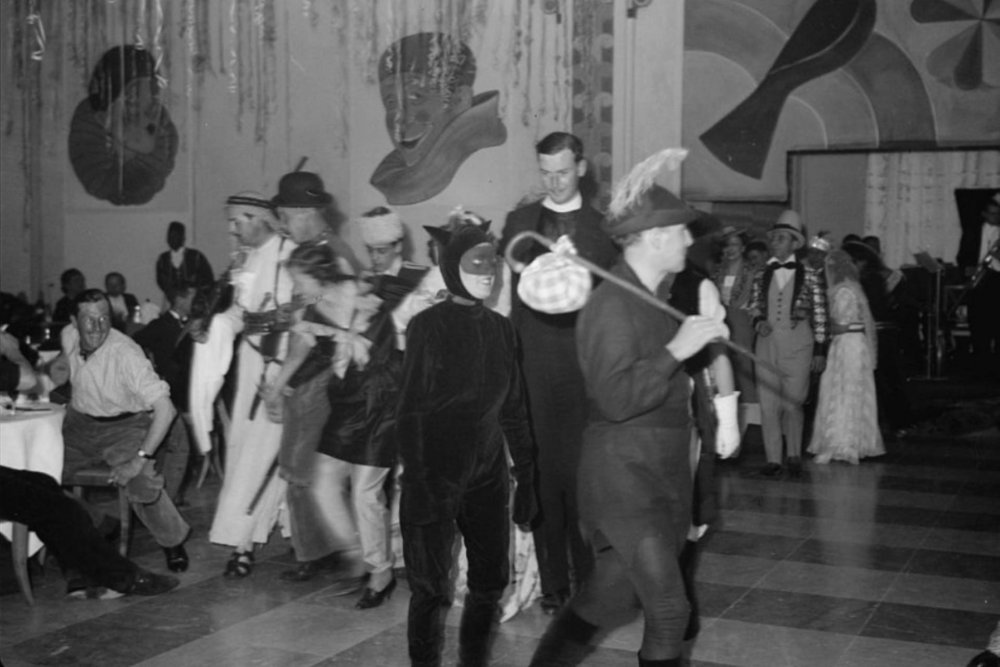 A lively gathering of partygoers and costumed guests celebrate Shrove Tuesday (the day before Lent) in the King David Hotel, February 21, 1939.
