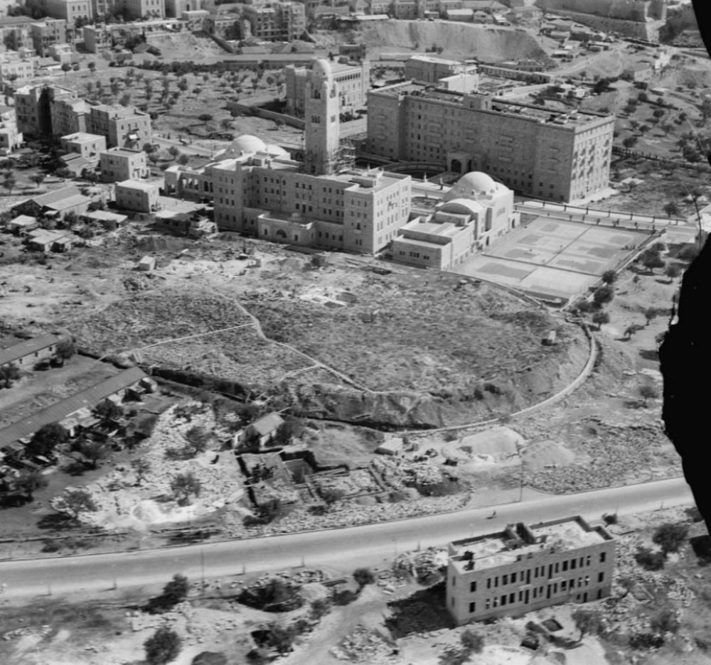 An aerial view of the King David Hotel and the YMCA building and tower, two massive buildings facing one another, ca. 1931–33