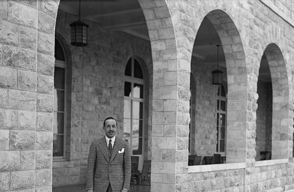 Former king Alfonso XIII of Spain stands near an entry to the King David Hotel in Jerusalem, March 3, 1932