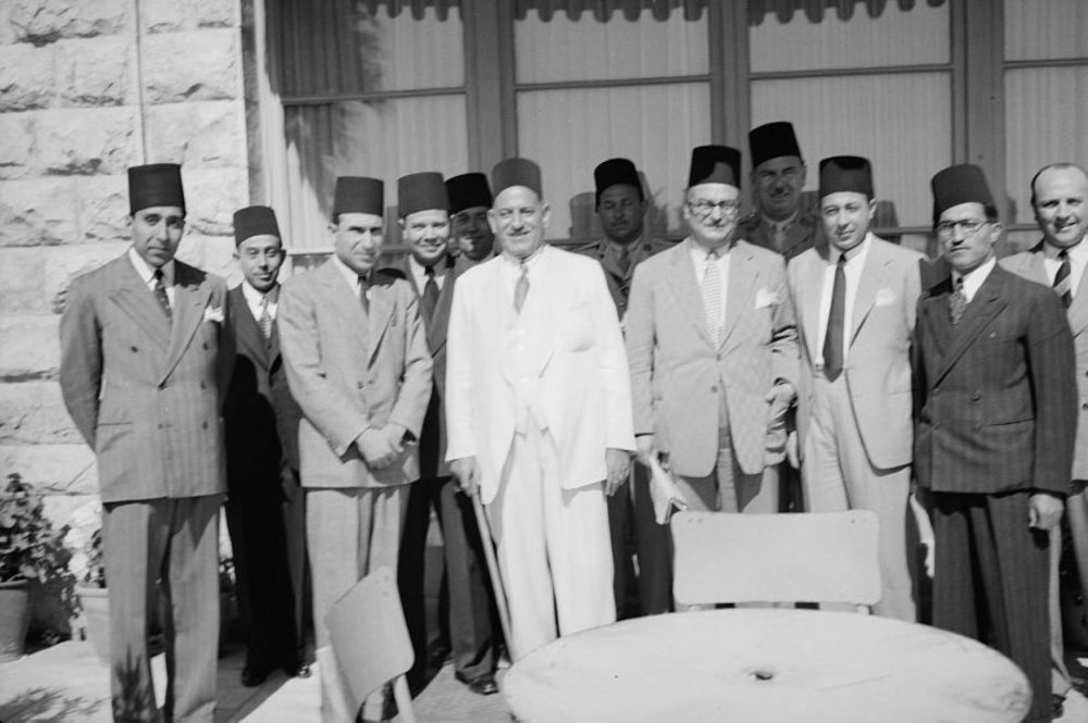 Mustafa al-Nahas Pasha of Egypt, prime minister and Wafd Party leader, with a group of men at the King David Hotel, June 1943