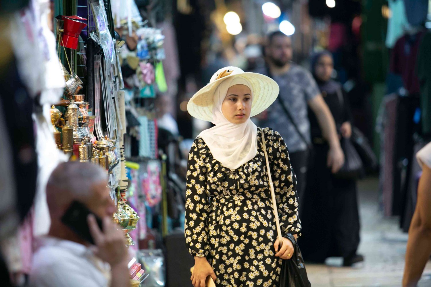 A woman strolls through the souq in the Old City of Jerusalem, 2021.