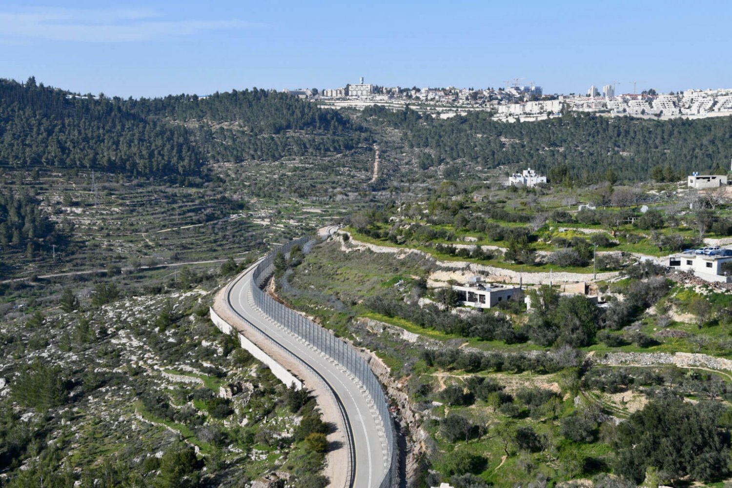 The Separation Wall slices the village of al-Walajeh
