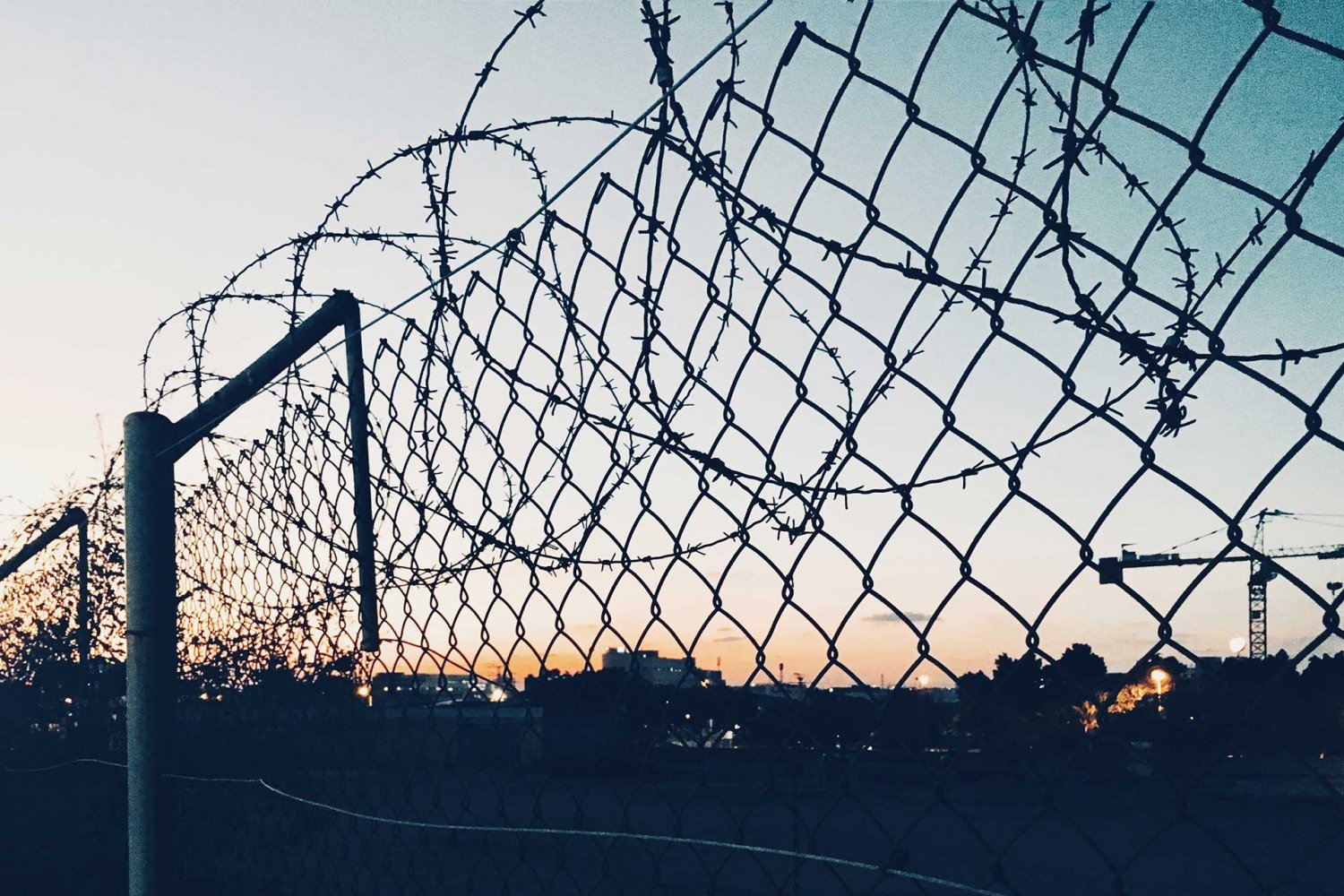 Grid fence with barbed wire, September 27, 2018, in Central District, Israel