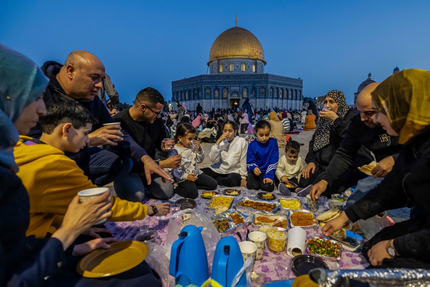 Palestinians break their Ramadan fast together with an Iftar meal at the al-Aqsa Mosque during the March 30, 2024. 
