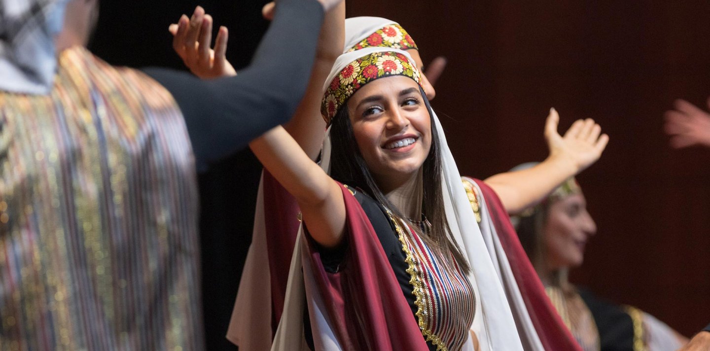 Smiling debka dancer performs at music festival in Jerusalem, 2022