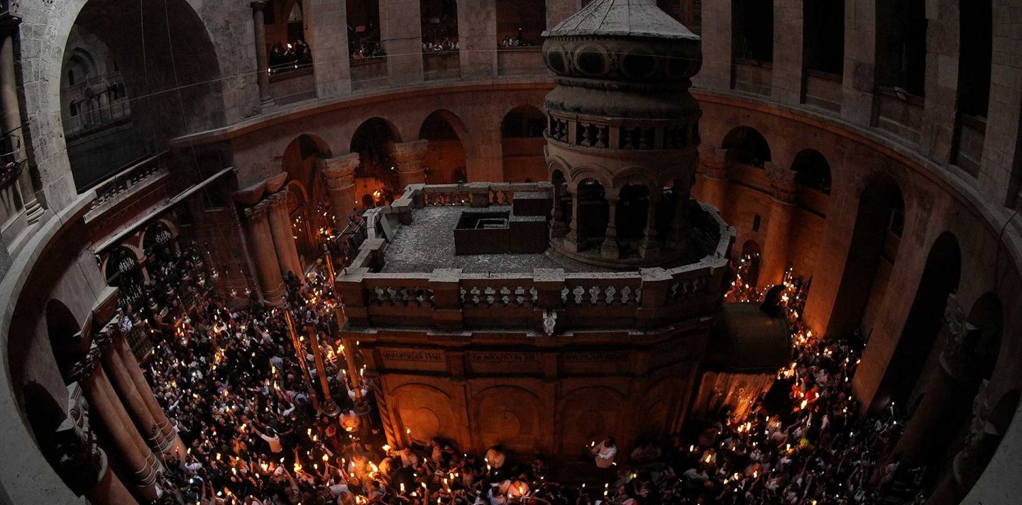 An overlooking view of the Holy Edicule in the Church of the Holy Sepulchre, surrounded by the Holy Fire, April 2022