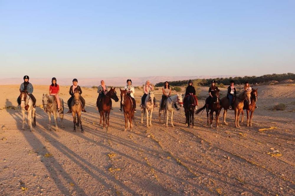 Ashira Ramadan takes young women former prisoners out on horseback for some riding therapy in Jericho, 2019