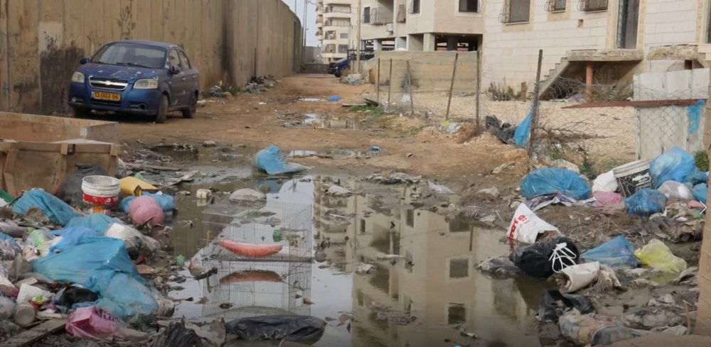 Garbage litters the streets of Kufr 'Aqab due to municipal neglect