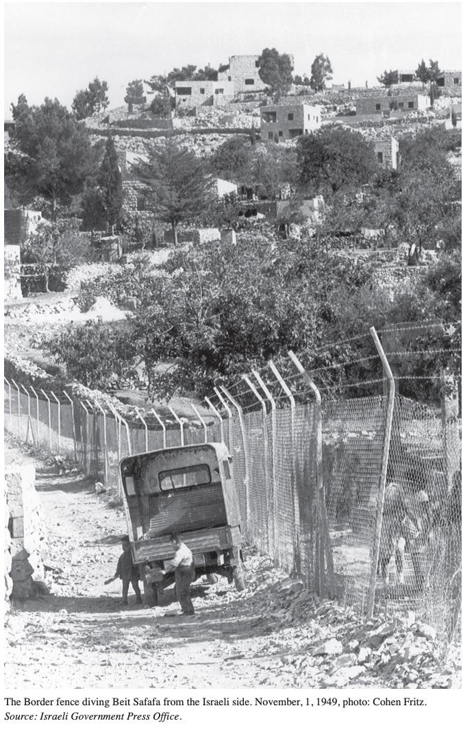 The fence dividing the Palestinian village of Beit Safafa along the 1949 Armistice Line