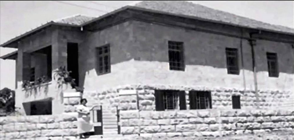 Sultana Sakakini stands outside her home in Katamon Jerusalem c. 1936