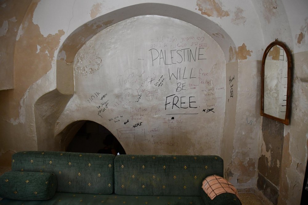 Words of resistance in Hebrew, Arabic, and English read “Palestine will be free,” and “This is our home” in the Ghayth-Sub Laban home. 