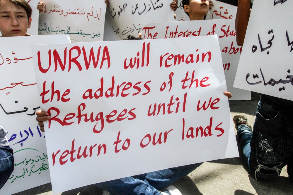 Palestinian children outside the UNRWA headquarters in the Askar refugee camp, near Nablus in the West Bank, protesting their unending status as refugees May 2023