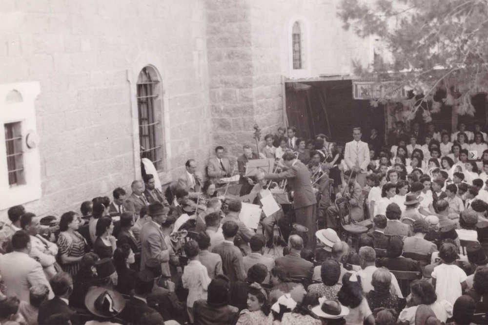 Salvador ‘Arnita conducts the Birzeit College Orchestra and Choir, Birzeit Old Campus, Palestine, 1941