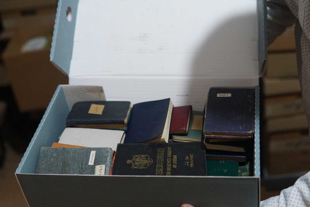 A box full of expired passports and old diaries