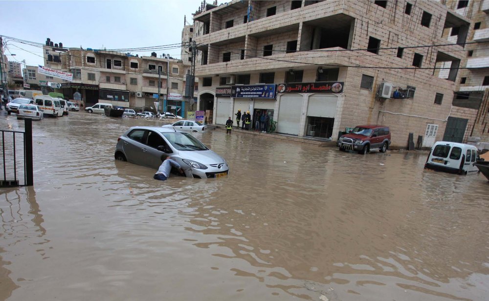Flooded streets during a heavy rain in the East Jerusalem neighborhood of Kufr ‘Aqab, March 12, 2014