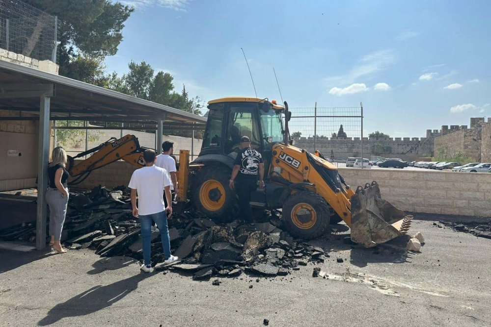 Bulldozers with Xana Capital Ltd. start tearing up the Cows' Garden parking lot in the Armenian Quarter,November 5, 2023