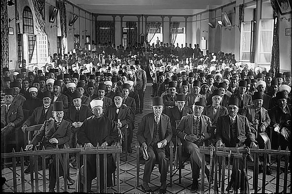 Arab protest delegation against British policy in Palestine (subsequent to the al-Buraq Uprising), meeting in the hall of the Rawdat al-Ma‘arif school, Jerusalem, 1929