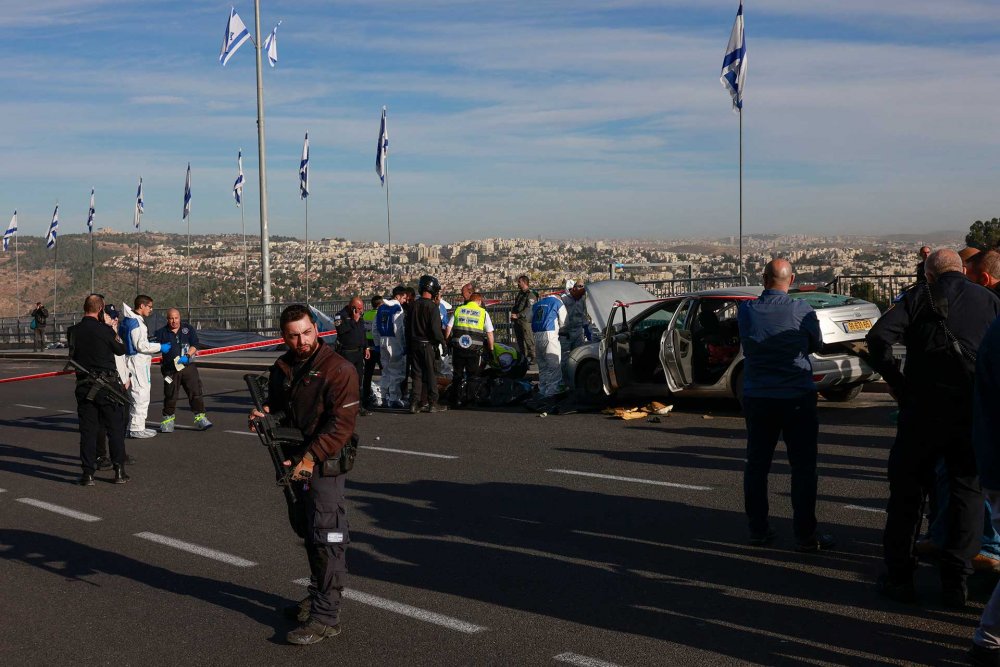Israeli police block a main road in Jerusalem after a shooting attack, November 30, 2023.