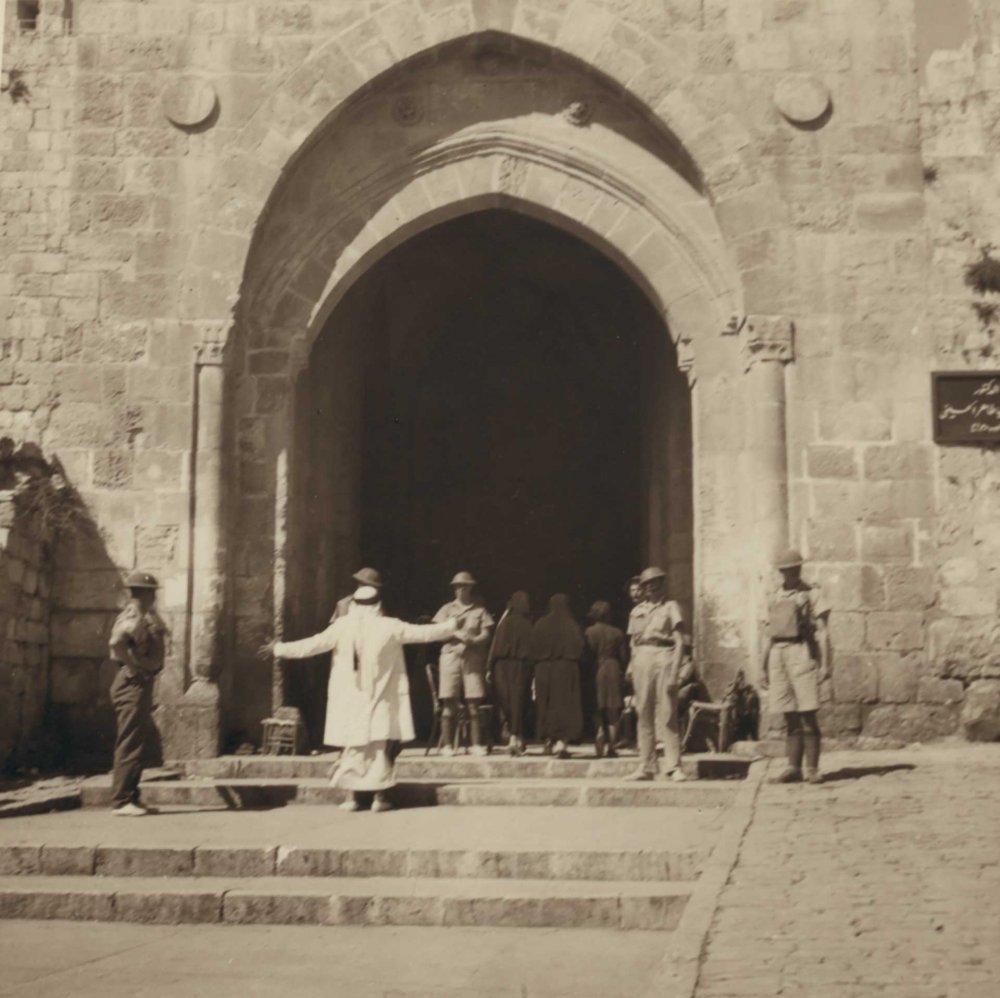British soldiers stop and frisk passersby at Damascus Gate, Jerusalem October 22, 1938.