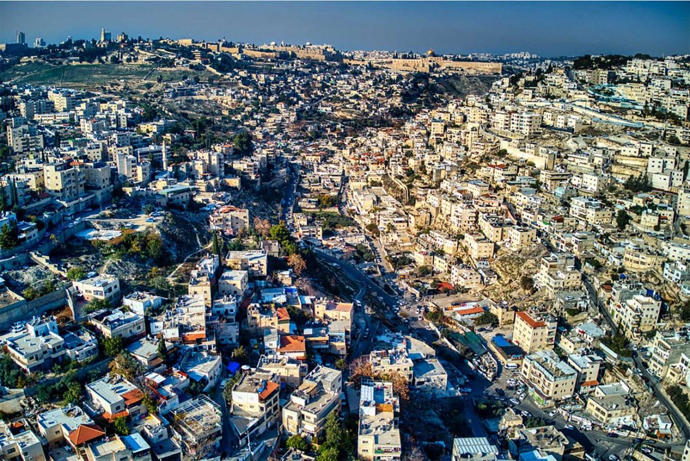 The center of Silwan with the Old City visible at the top