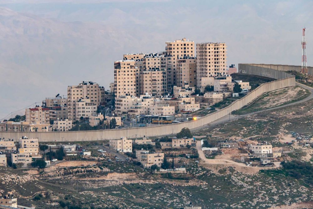 Israel’s Separation Wall, cutting through a Palestinian neighborhood, Abu Dis