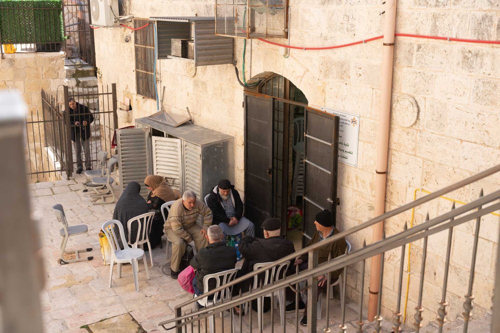Palestinian Jerusalemites wait outside a soup kitchen in Jerusalem’s Old City during Ramadan, March 20, 2024.