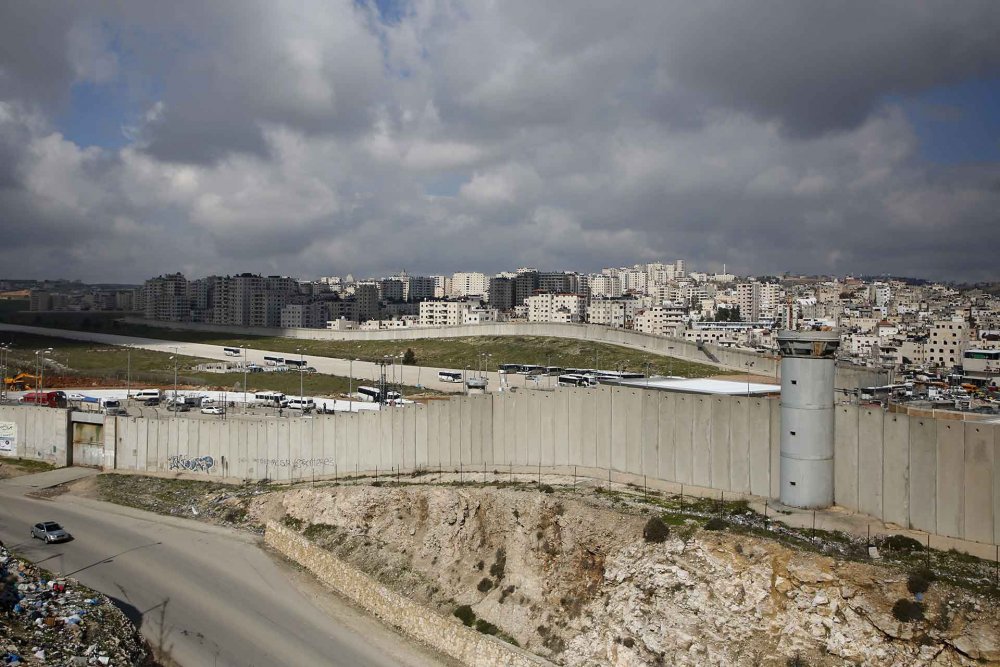 The Separation Wall severing the Palestinian neighborhood of Kufr ‘Aqab from the rest of East Jerusalem, January 30, 2018.