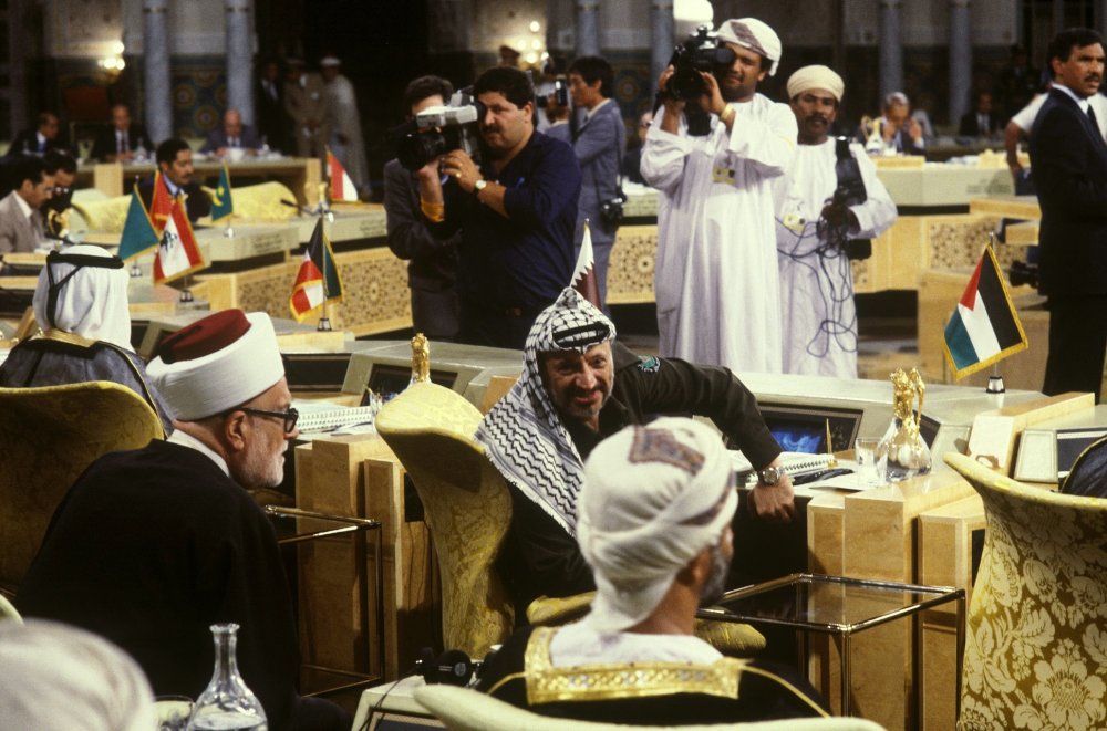 Abd al-Hamid al-Sayih seated behind Yasser Arafat at the extraordinary Arab Summit meeting held in Morocco in August 1985