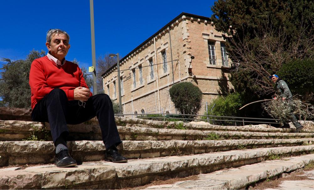 Sani Meo next to his grandfather’s home in Upper Baq‘a, West Jerusalem, 2021