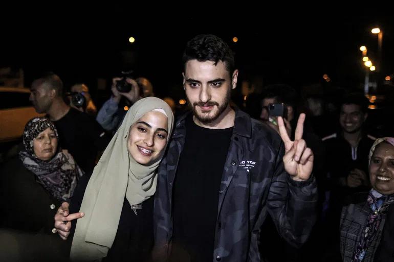 Jerusalem activists and social media influencers Muna and Mohammed el-Kurd holding up a victory sign