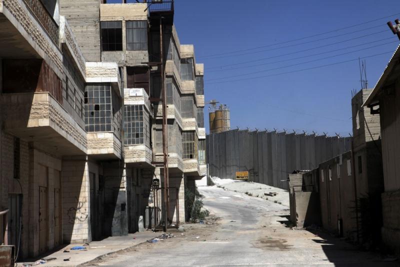 A view of the effect of the Separation Wall in Bir Nabala, where buildings have all been abandoned, 2012