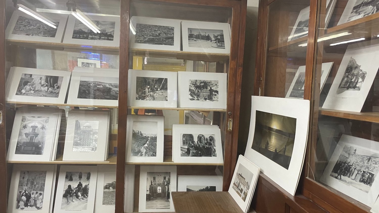 Elia Kahvedjian displays his grandfather's black and white old photos in his shop