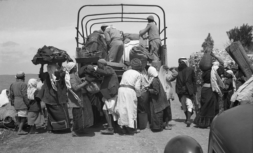 Villagers evacuating Qaluniya (Colonia), a village on the Jaffa-Jerusalem highway targeted by Zionist forces