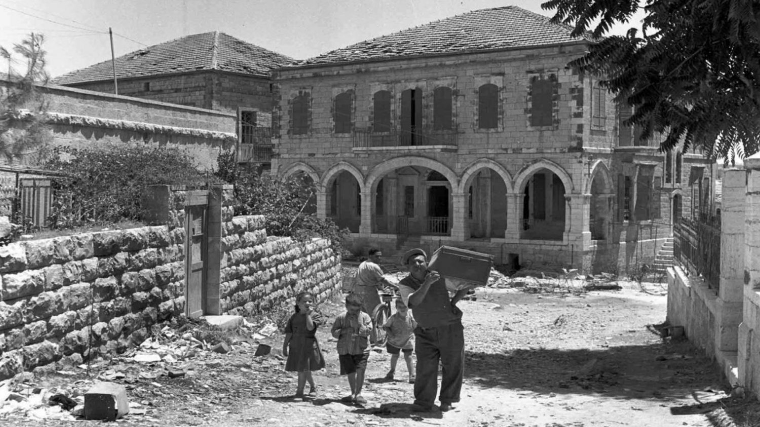 Jewish Israelis looting the depopulated homes of wealthy Palestinians in Musrara neighborhood, northwest of the Old City, in 1948