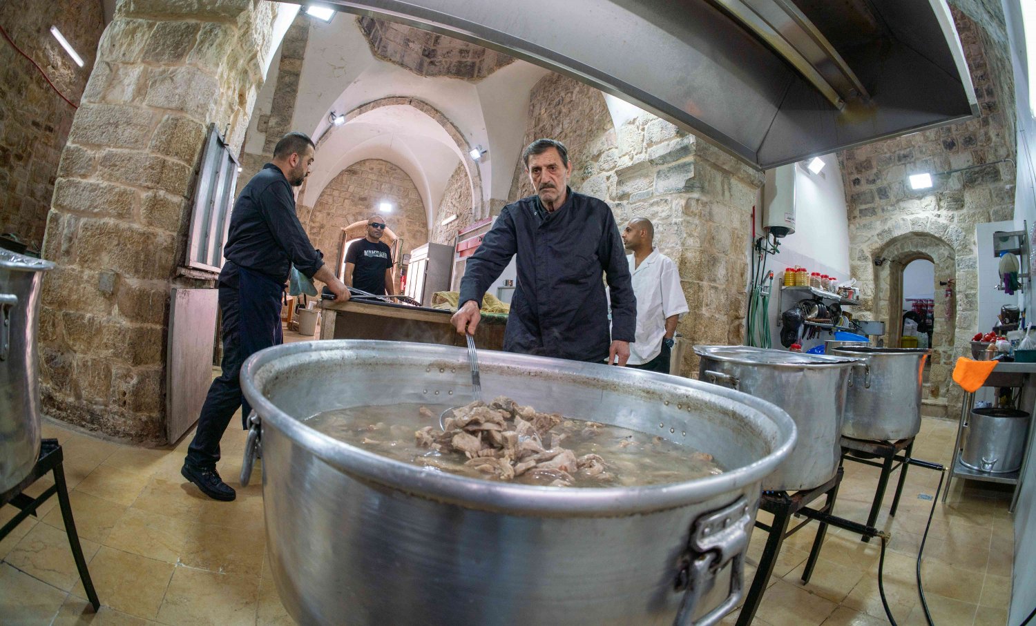 Samir Jaber prepares the lamb for mansaf in the Khaski Sultan soup kitchen in the Old City of Jerusalem 
