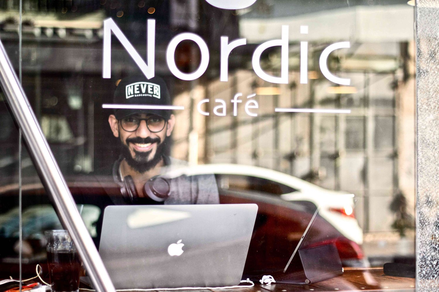 A young man at the Nordic Cafe, a popular hangout on al-Zahra Street in East Jerusalem, 2021