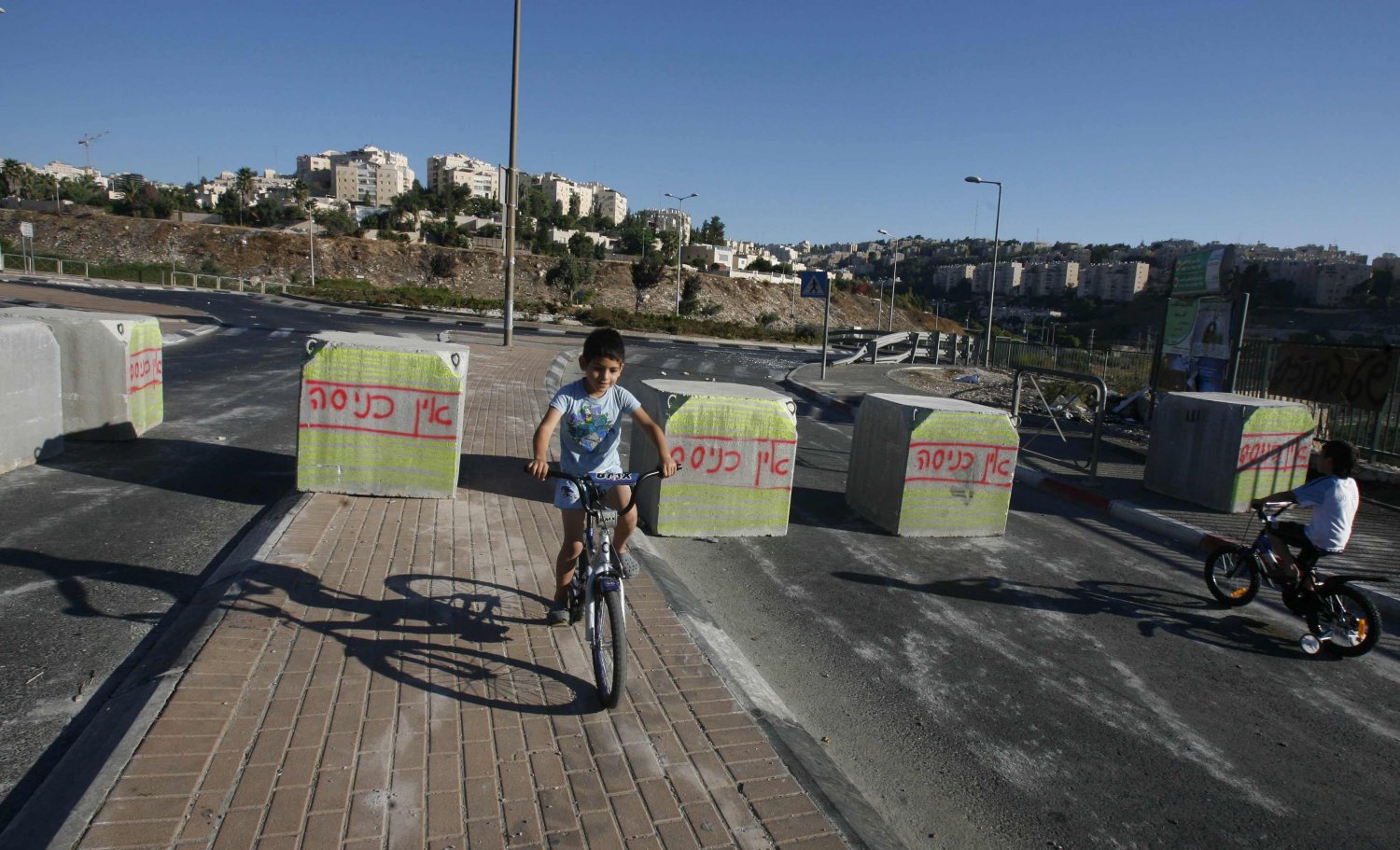 Cement blocks are placed on Jerusalem's main roads on Yom Kippur to prevent Palestinian entry into Jewish setlements
