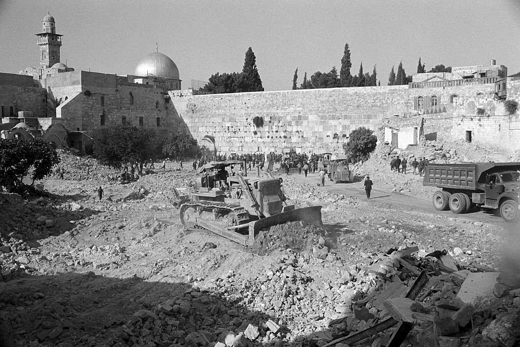 Israeli bulldozers destroying the ancient Moroccan Quarter in the Old City of Jerusalem on June 10–12, 1967