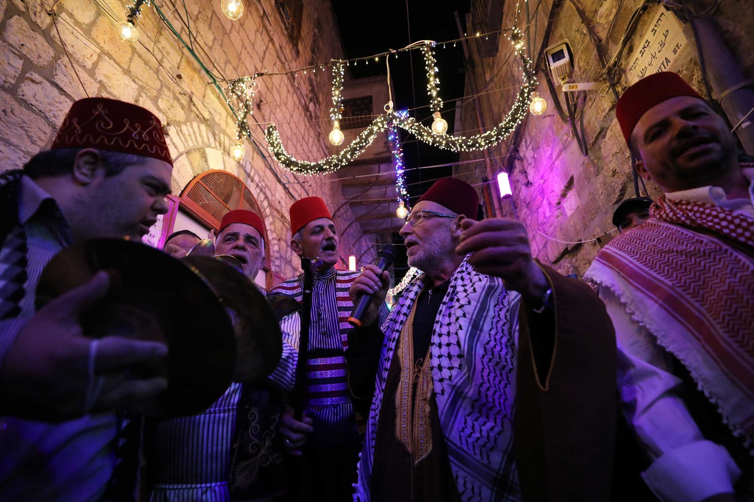 A munshidin (chanters) group sings a cappella in the Old City of Jerusalem during Ramadan 2022