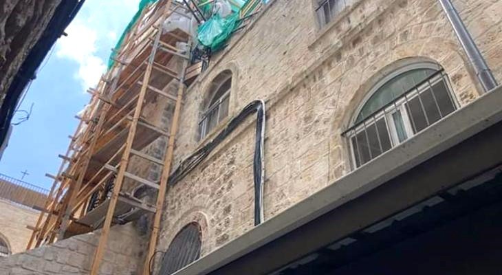 Scaffolding against Dar al-Consul, an ancient structure restored in Jerusalem's Old City