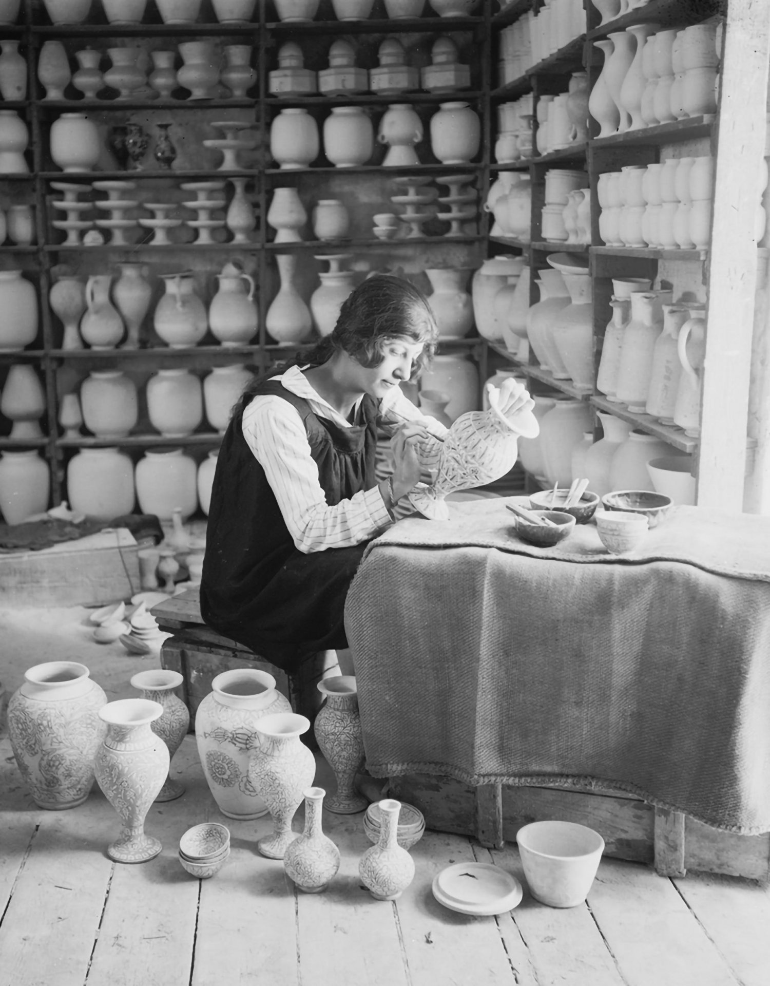 A woman painting a pottery vase at the Dome of the Rock Tiles workshop, Via Dolorosa, Jerusalem, 1920s