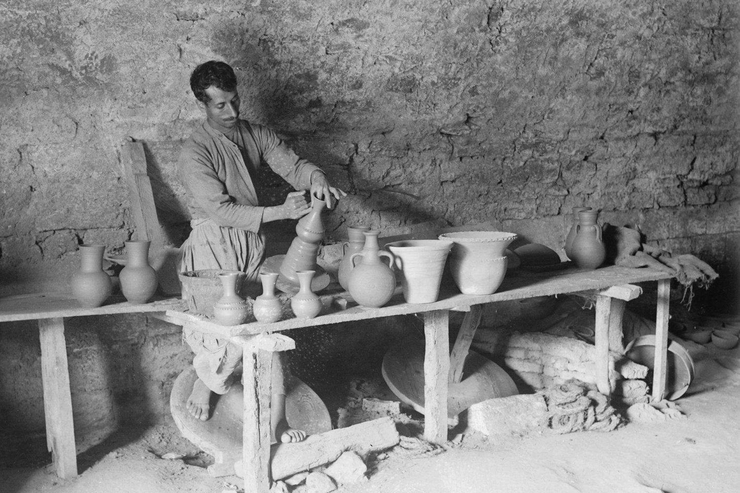 Male potter throwing a pot on the wheel at the Dome of the Rock Tiles Workshop on the Via Dolorsa, Jerusalem, 1920s