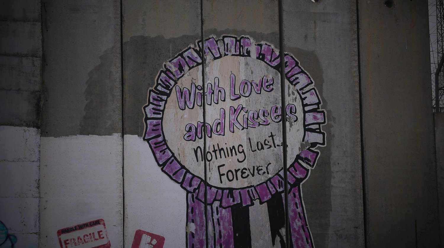 Graffiti reading "Nothing Lasts Forever" on the Separation Wall outside al-Karawan restaurant, 2021