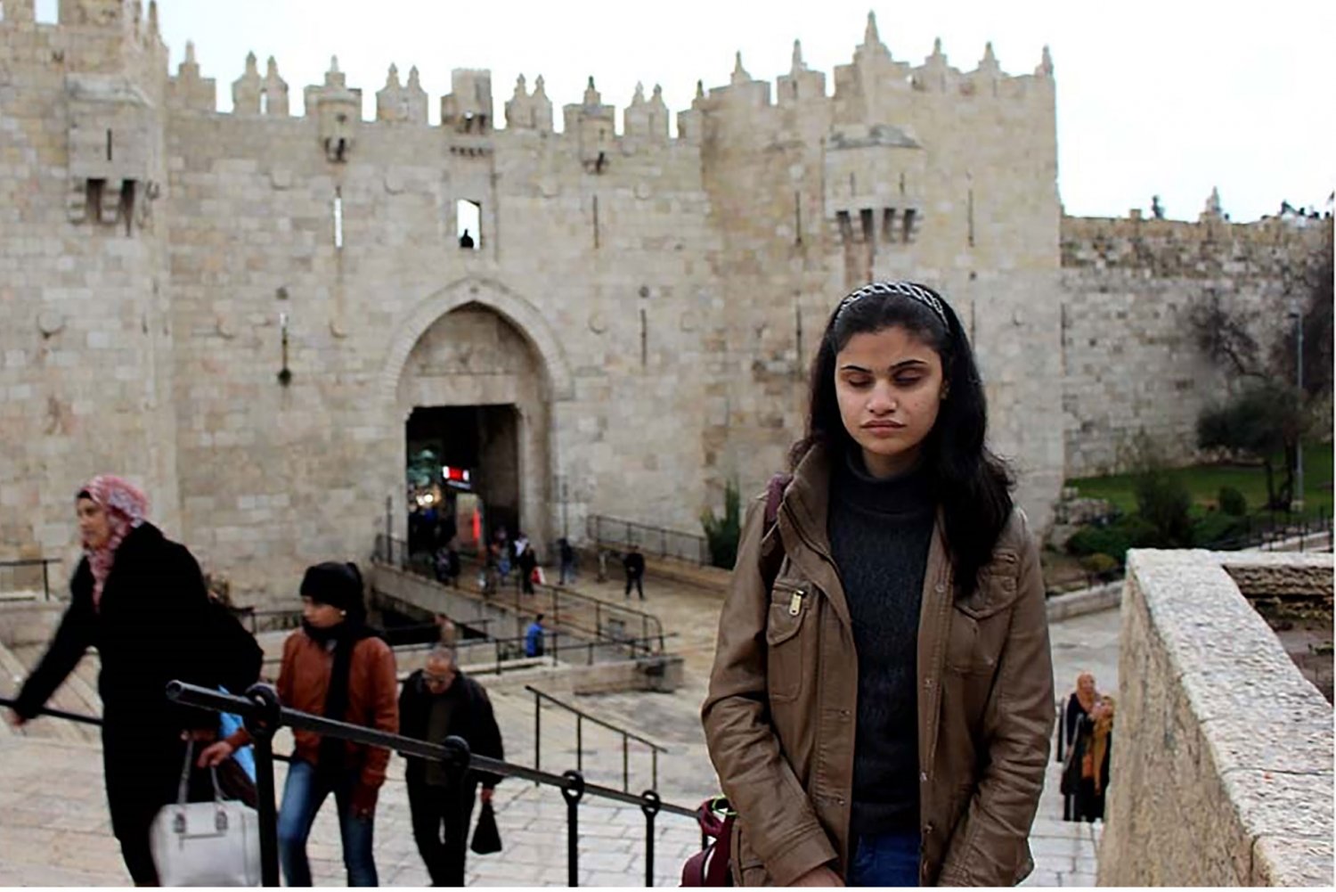 Blind legal expert Bodour Hassan stands outside Jerusalem's Damascus Gate