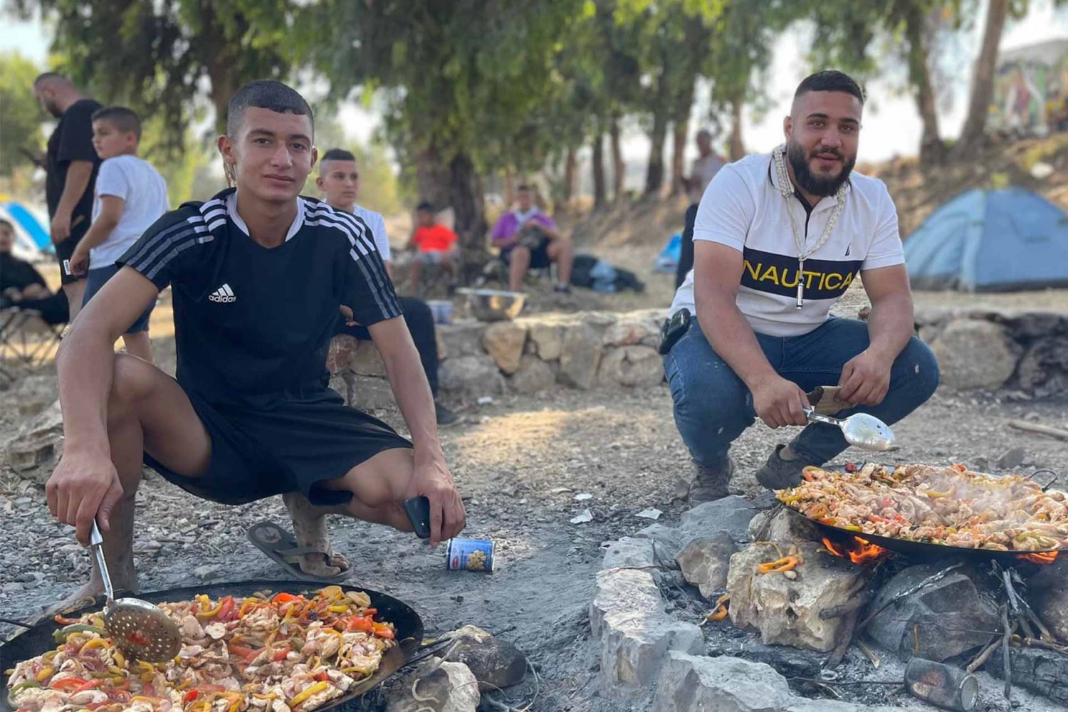 Dinner cooked campsite-style over the fire during “Silwan Summer 2022,” a youth camp for the al-Bustan district scout group